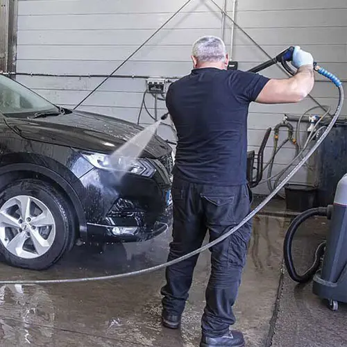 Car being cleaned before it is handed back to its owner